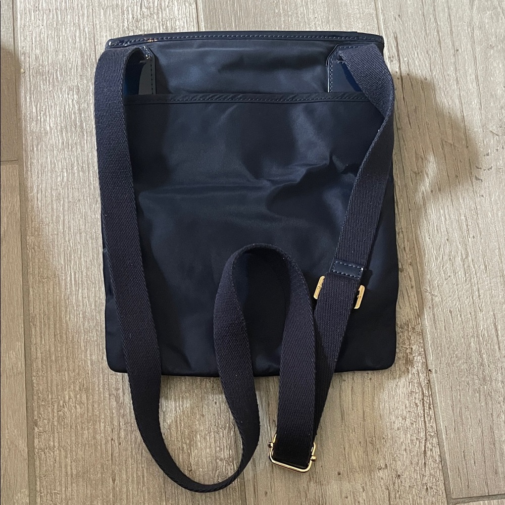 Classy Tory Burch Navy Crossbody Bag
9”W x 10 3/4”L - Picture 3 of 4
